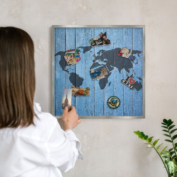 Souvenir magnet display board with a silver frame World map