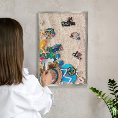Souvenir magnet display board with a silver frame Summer relaxation