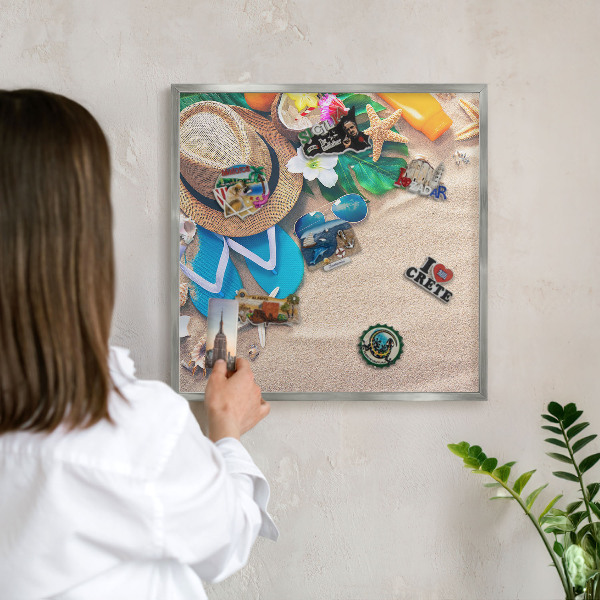 Souvenir magnet display board with a silver frame Summer relaxation