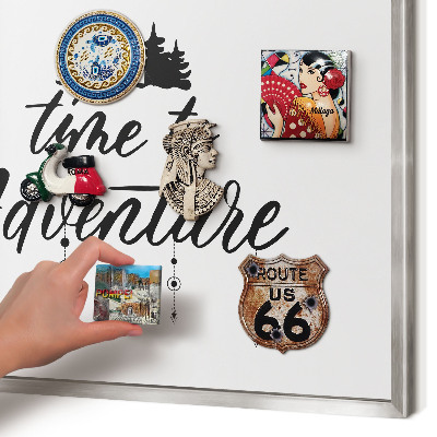Souvenir magnet display board with a silver frame Adventure awaits