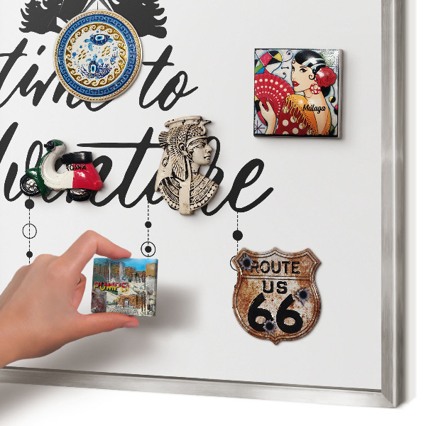 Souvenir magnet display board with a silver frame Adventure awaits