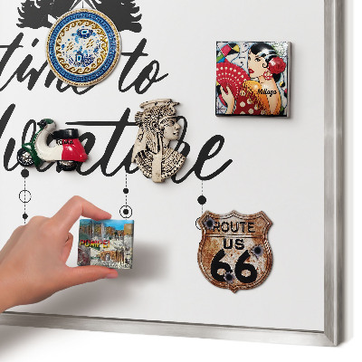 Souvenir magnet display board with a silver frame Adventure awaits
