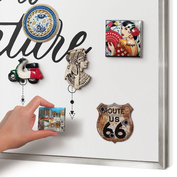 Souvenir magnet display board with a silver frame Adventure awaits