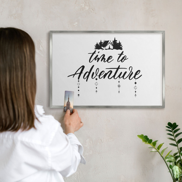 Souvenir magnet display board with a silver frame Adventure awaits