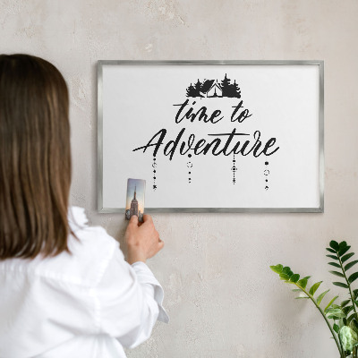 Souvenir magnet display board with a silver frame Adventure awaits