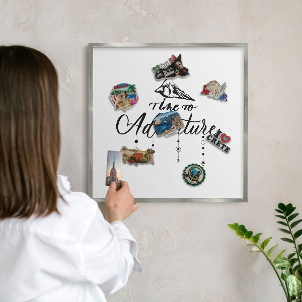 Souvenir magnet display board with a silver frame Mountain adventure