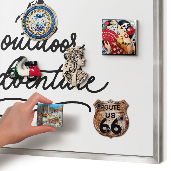 Souvenir magnet display board with a silver frame Mountain adventure