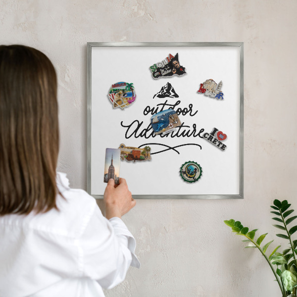 Souvenir magnet display board with a silver frame Mountain adventure
