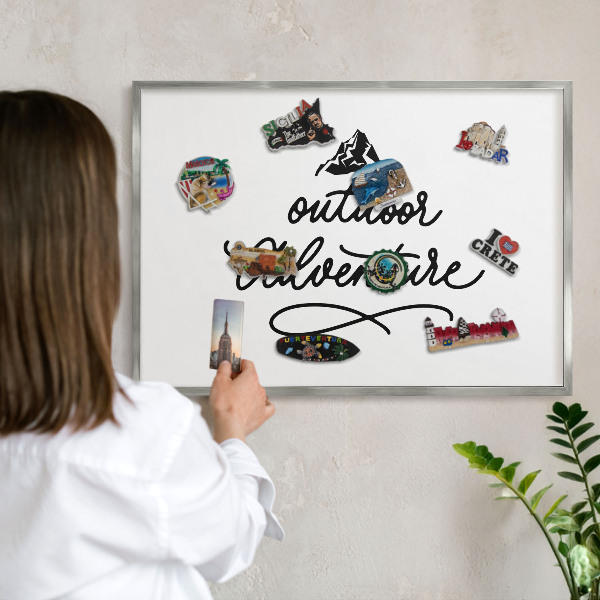 Souvenir magnet display board with a silver frame Mountain adventure