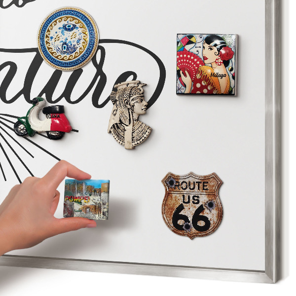 Souvenir magnet display board with a silver frame The Journey of Discovery