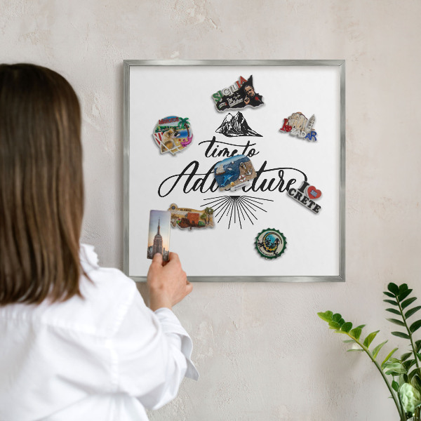 Souvenir magnet display board with a silver frame The Journey of Discovery