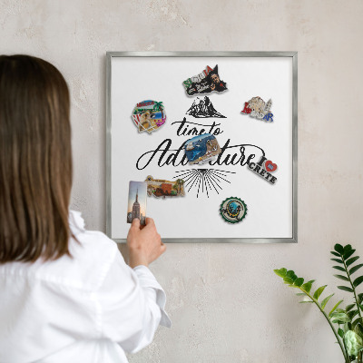 Souvenir magnet display board with a silver frame The Journey of Discovery