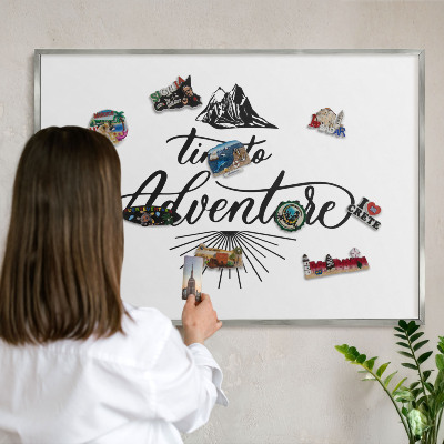 Souvenir magnet display board with a silver frame The Journey of Discovery
