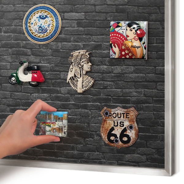 Souvenir magnet display board with a silver frame Brick wall