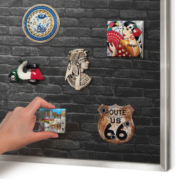 Souvenir magnet display board with a silver frame Brick wall