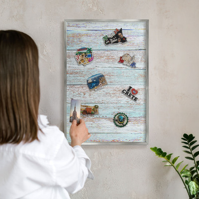 Souvenir magnet display board with a silver frame Rustic boards