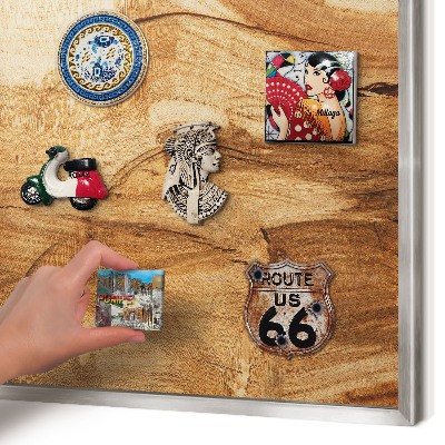Souvenir magnet display board with a silver frame Natural wood