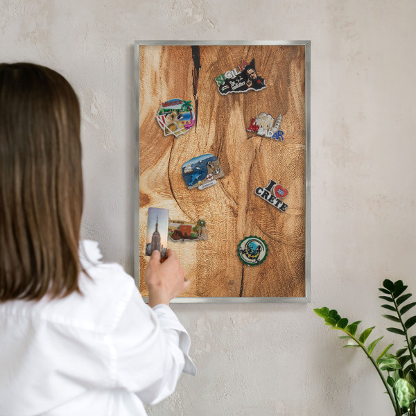 Souvenir magnet display board with a silver frame Natural wood