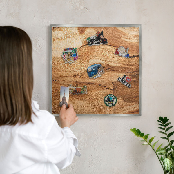 Souvenir magnet display board with a silver frame Natural wood