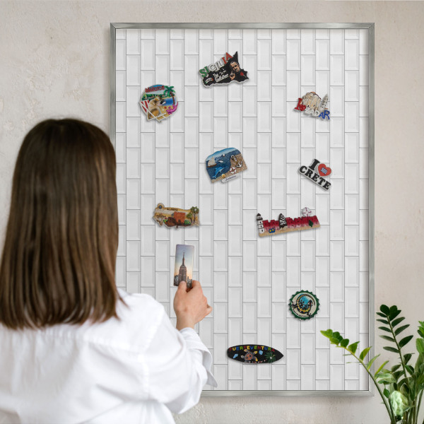 Souvenir magnet display board with a silver frame White bricks