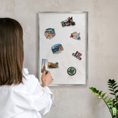 Souvenir magnet display board with a silver frame Marble elegance