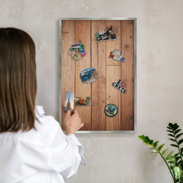 Souvenir magnet display board with a silver frame Wooden boards