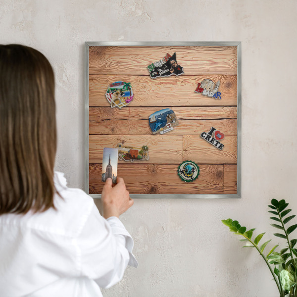 Souvenir magnet display board with a silver frame Wooden boards