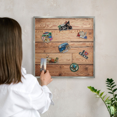 Souvenir magnet display board with a silver frame Wooden boards