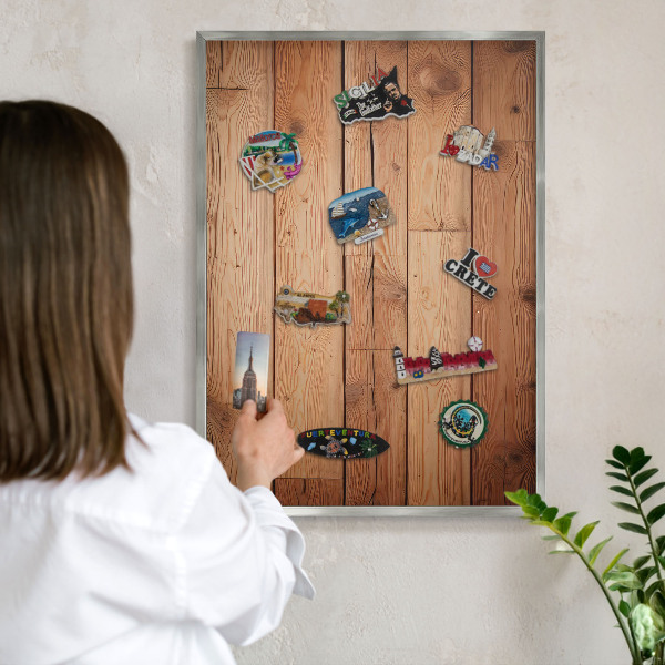 Souvenir magnet display board with a silver frame Wooden boards