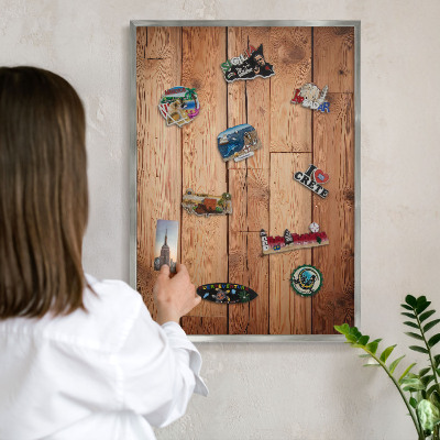 Souvenir magnet display board with a silver frame Wooden boards