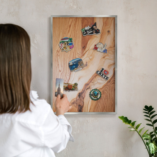 Souvenir magnet display board with a silver frame Wooden texture