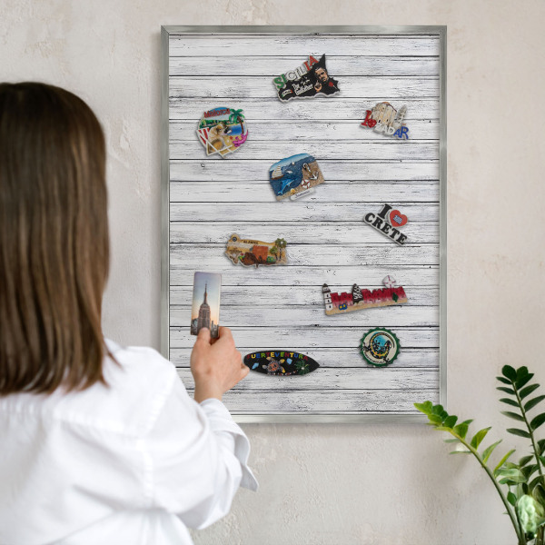 Souvenir magnet display board with a silver frame Light wood