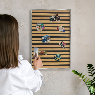 Souvenir magnet display board with a silver frame Wooden rhythms
