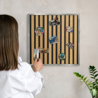 Souvenir magnet display board with a silver frame Wooden rhythms
