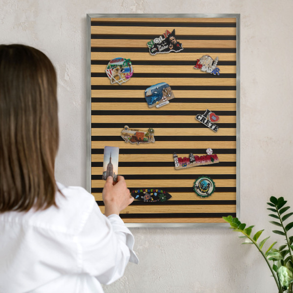 Souvenir magnet display board with a silver frame Wooden rhythms