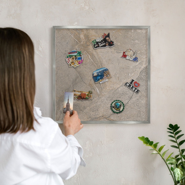 Souvenir magnet display board with a silver frame Beige stone