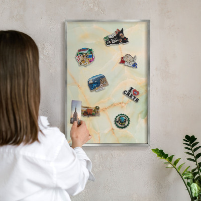Souvenir magnet display board with a silver frame Marble elegance