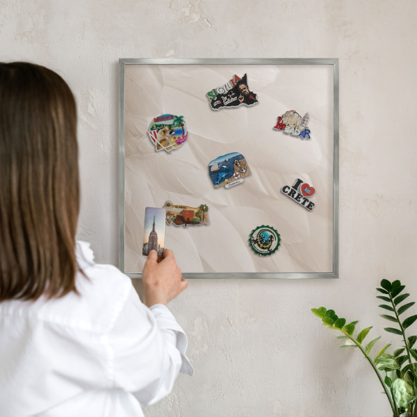 Souvenir magnet display board with a silver frame Cream feathers