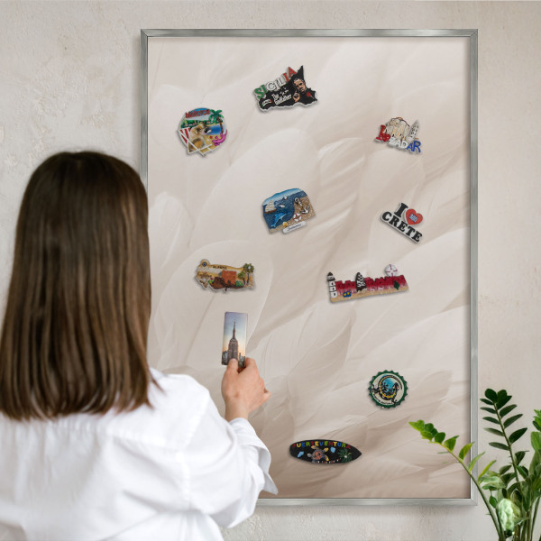 Souvenir magnet display board with a silver frame Cream feathers