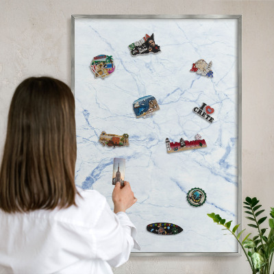 Souvenir magnet display board with a silver frame Marble design