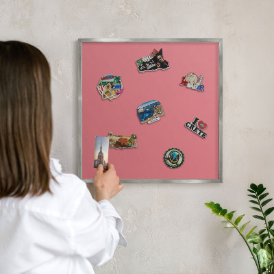Souvenir magnet display board with a silver frame Salmon color
