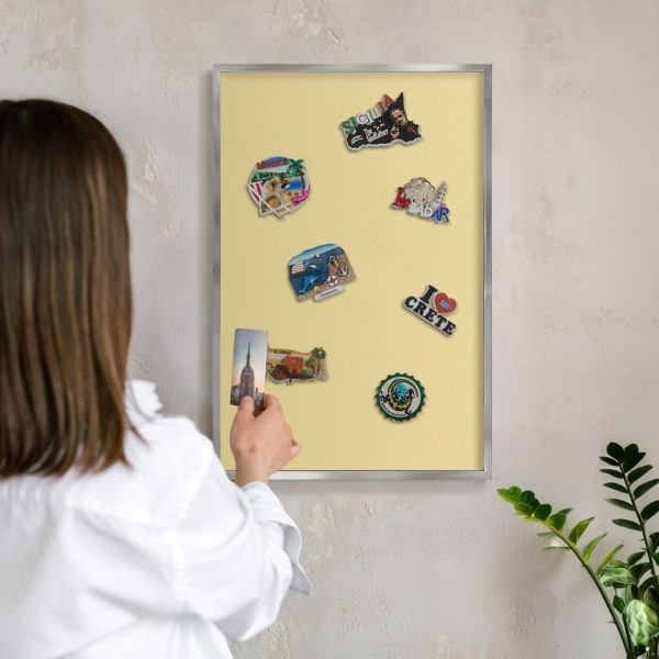 Souvenir magnet display board with a silver frame Creamy yellow
