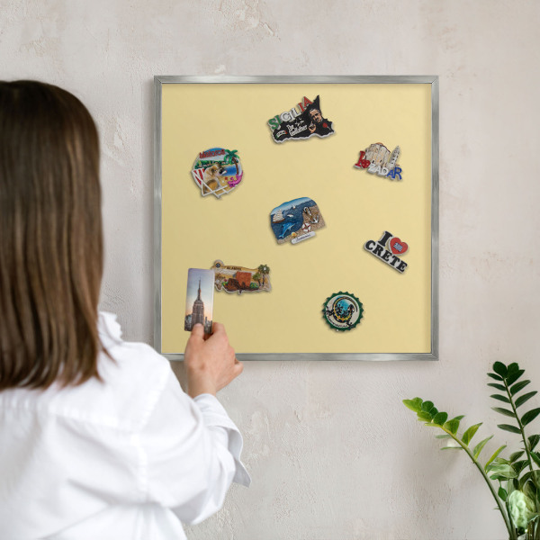 Souvenir magnet display board with a silver frame Creamy yellow