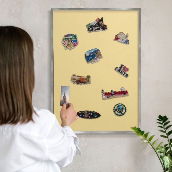 Souvenir magnet display board with a silver frame Creamy yellow