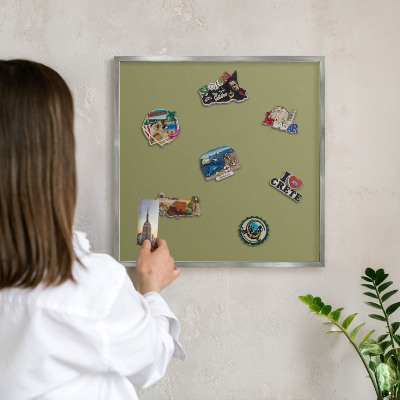 Souvenir magnet display board with a silver frame Green grass