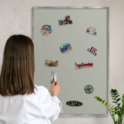 Souvenir magnet display board with a silver frame Neutral gray