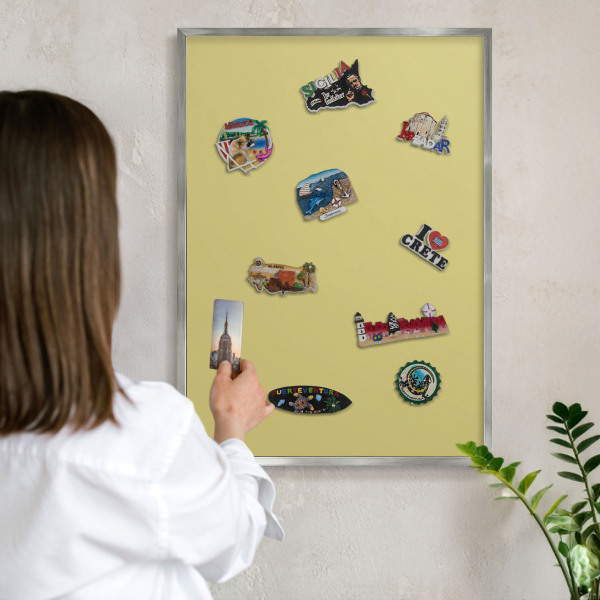 Souvenir magnet display board with a silver frame Light mustard