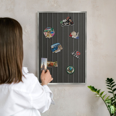 Souvenir magnet display board with a silver frame Panel texture