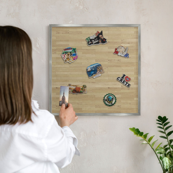 Souvenir magnet display board with a silver frame Wooden texture
