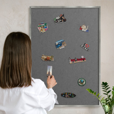 Souvenir magnet display board with a silver frame Gray texture
